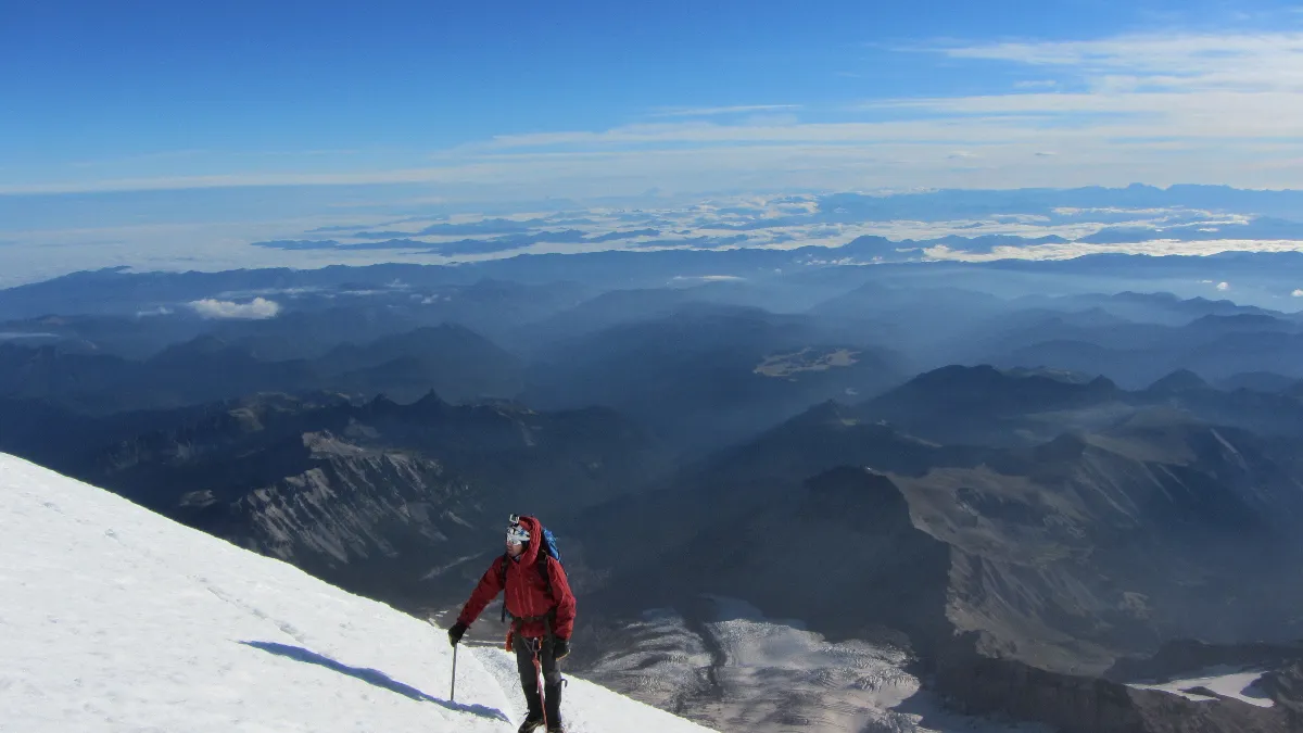 A view of me on side of mountain with landscape in background